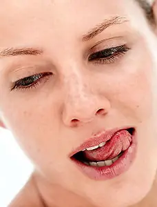 Patient demonstrating healthy teeth and gums after treatment at the dental clinic